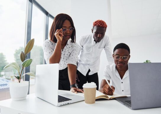 using-same-laptop-for-the-project-group-of-african-american-business-people-working-in-office-together-free-photo